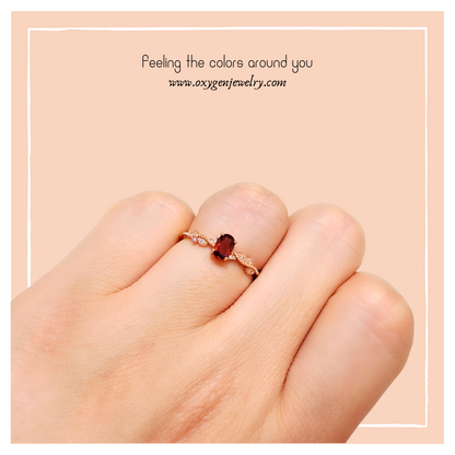 Oval Garnet and Round Zirconia Ring