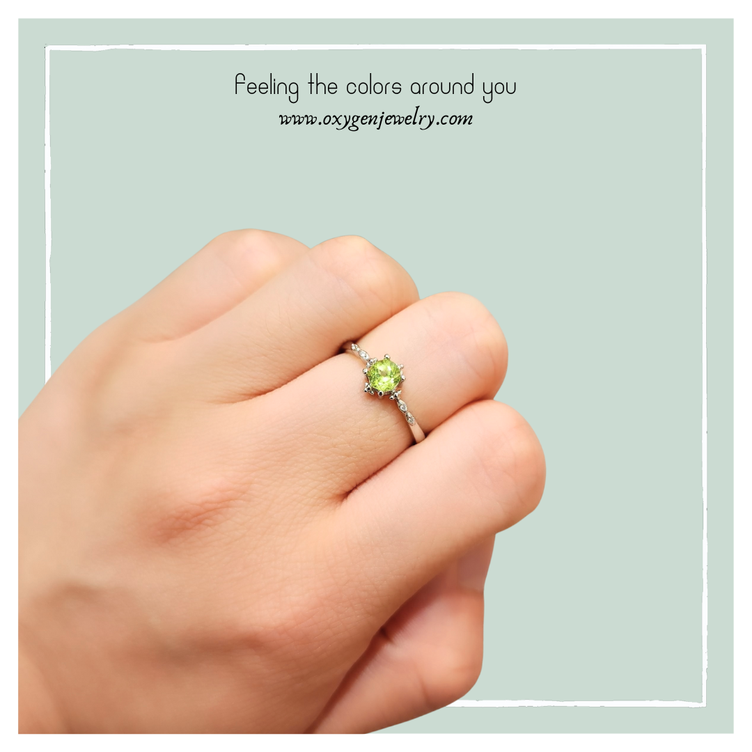 Peridot and zirconia cross ring