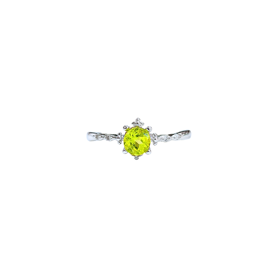 Peridot and zirconia cross ring