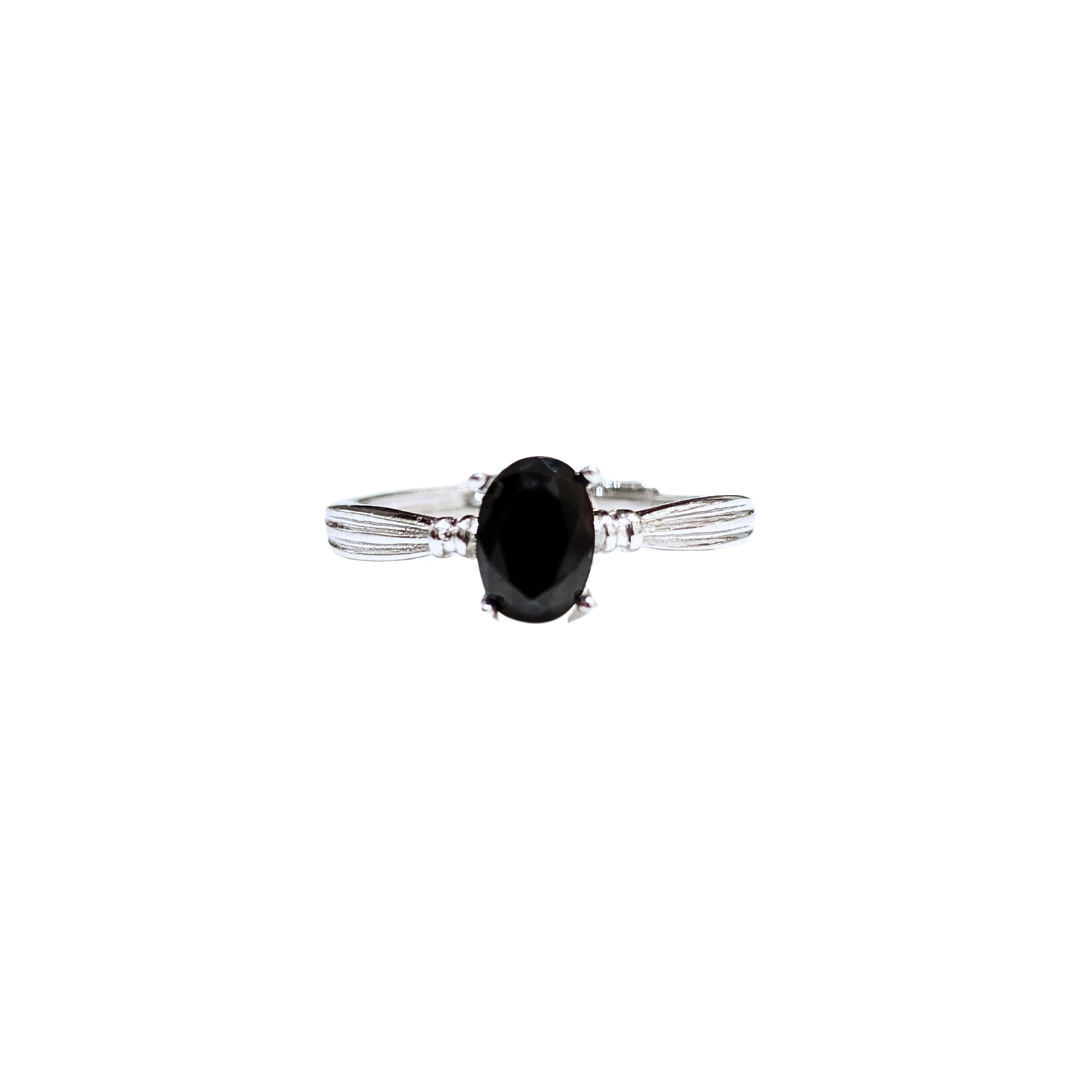 Oval black spinel and round zirconia ring